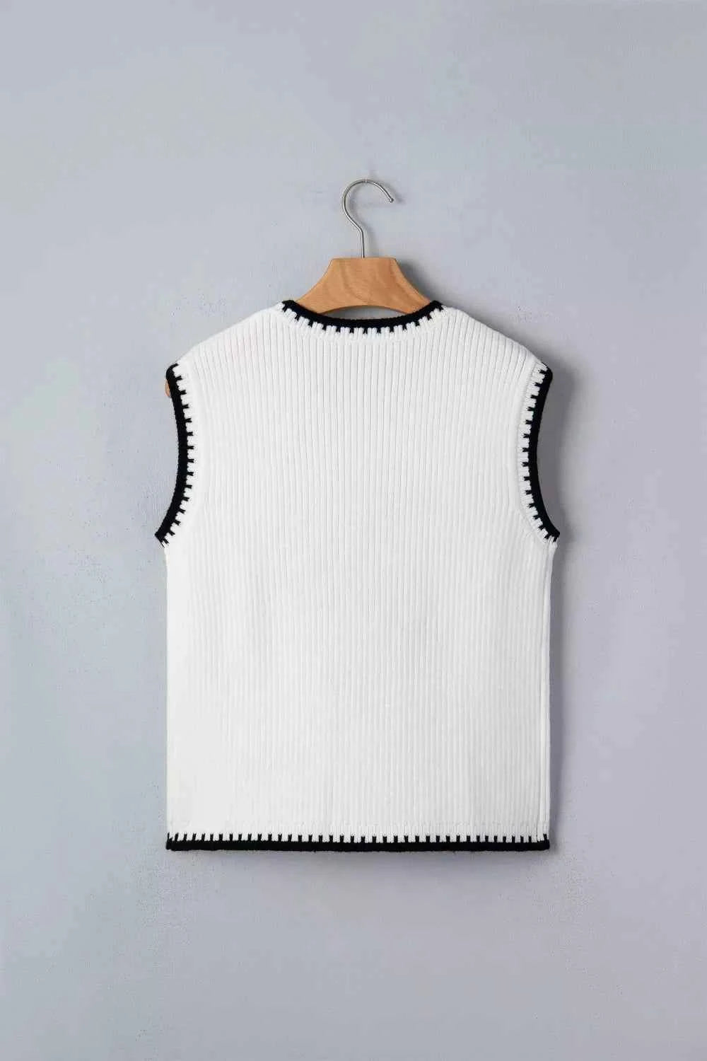 White Rodeo Cowboy sweater vest with contrast trim, stylish and comfortable, ideal for western-inspired fashion.