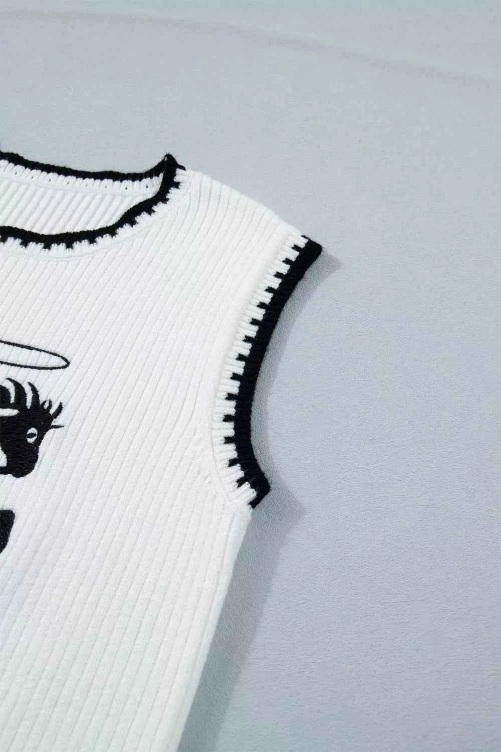 White Rodeo Cowboy Sweater Vest with contrast trim by Trendsi, featuring a stylish design and comfortable fit.