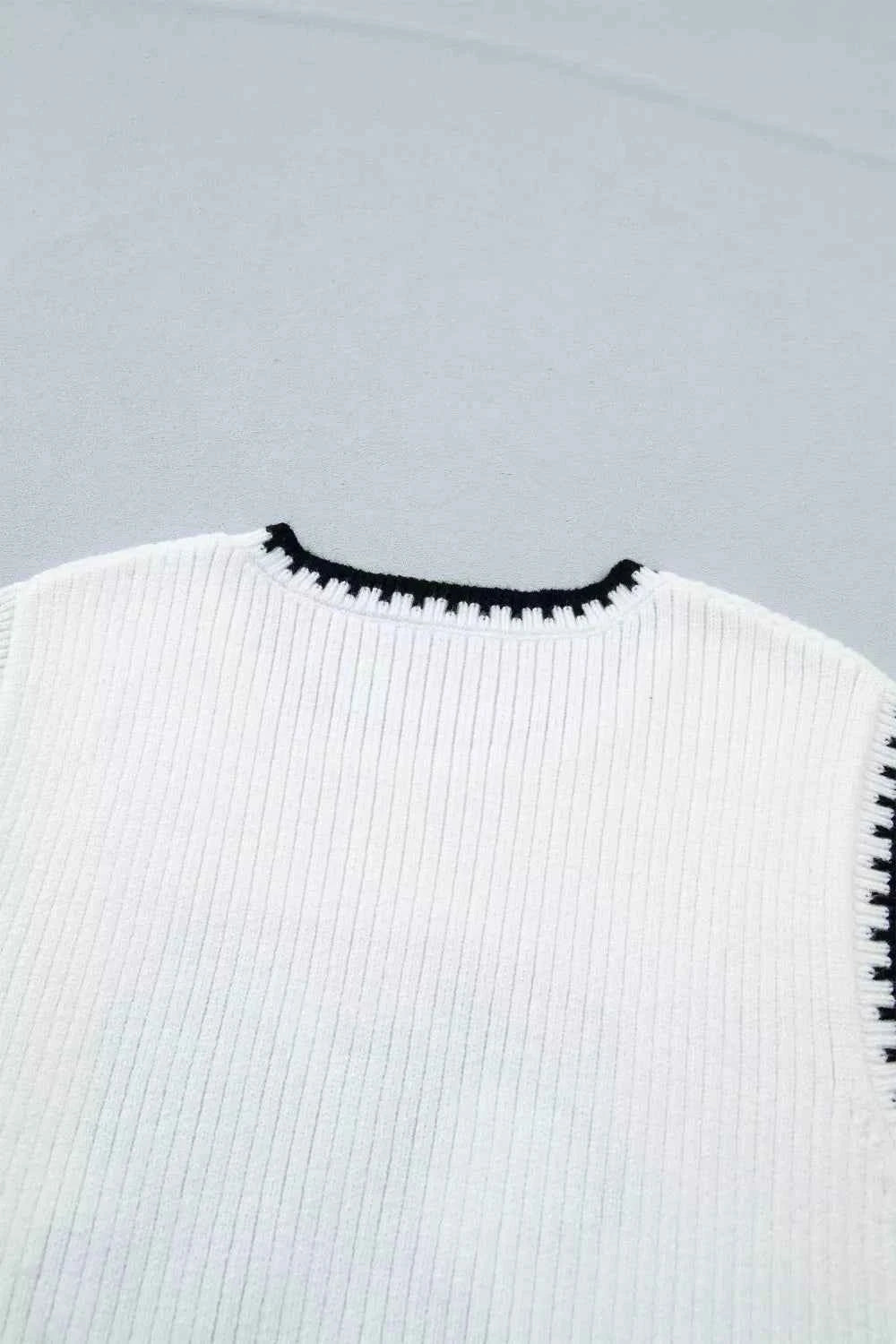 White Rodeo Cowboy Sweater Vest with contrast trim, stylish and comfortable, featuring a classic Western-inspired design.