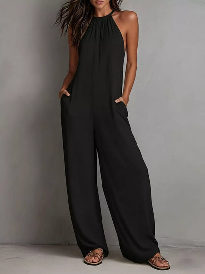 White sleeveless wide-leg jumpsuit by Trendsi, featuring a relaxed fit and flowing fabric, perfect for casual or summer wear.