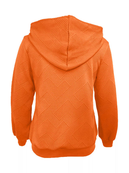 Texture zip-up hoodie with drawstring from Trendsi, shown in a close-up image highlighting the fabric texture and hoodie details.