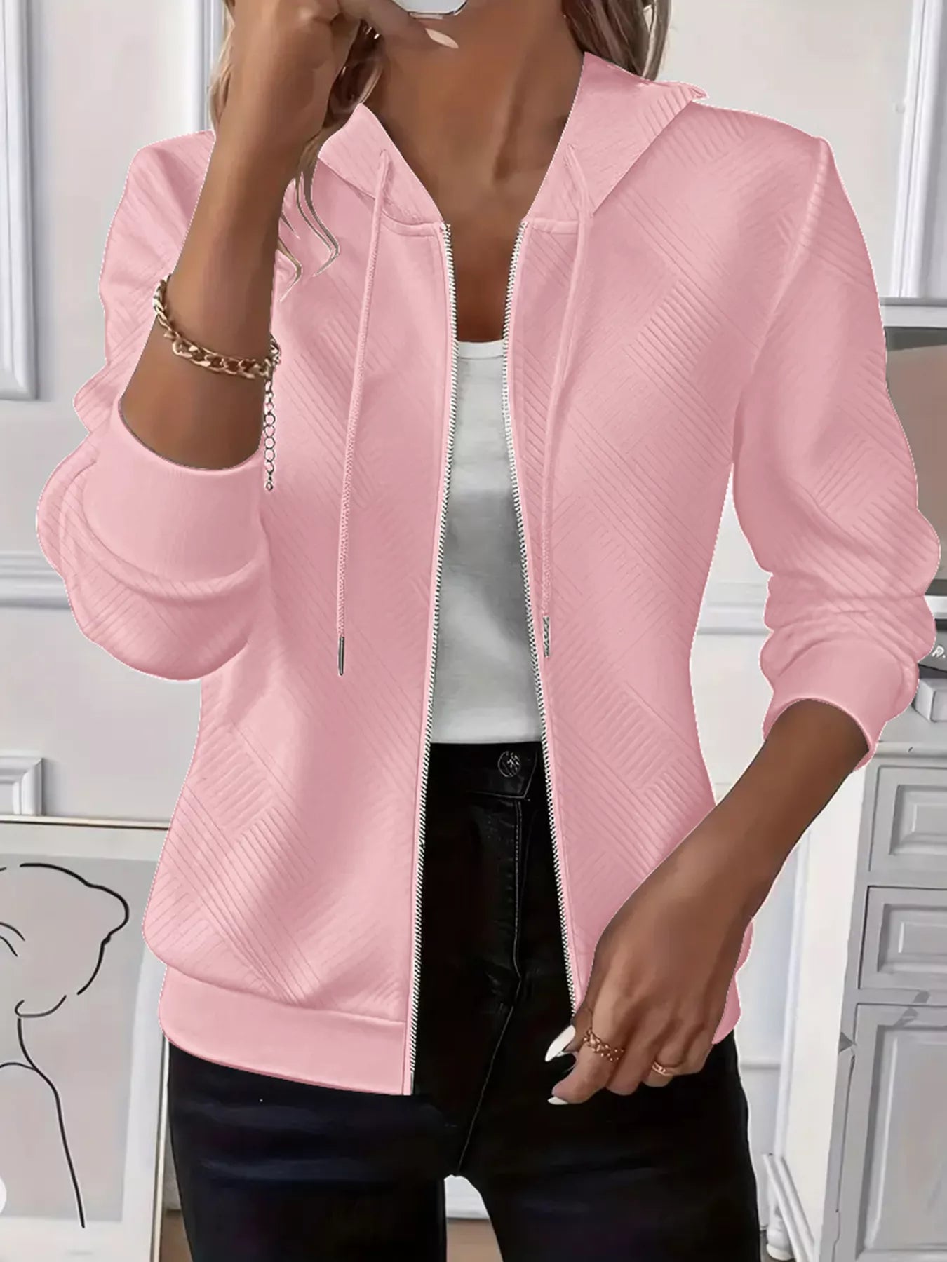 Texture zip-up hoodie with drawstring, casual fashion from Trendsi featuring a soft, textured fabric and front zipper closure.