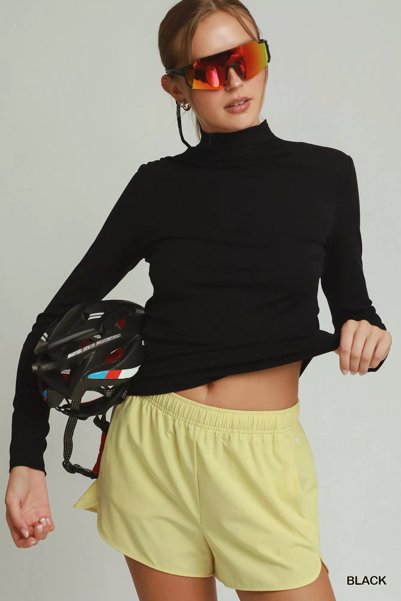 Black women's long sleeve mock neck top by Umgee, casual trendy top with fitted design and soft fabric.
