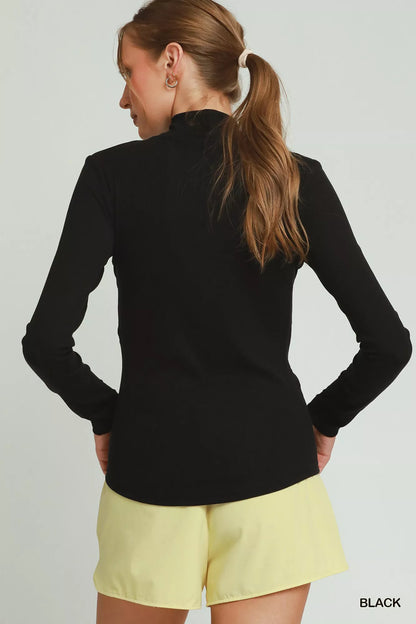 Black Umgee long sleeve mock neck top for women, stylish and comfortable, shown on a model.