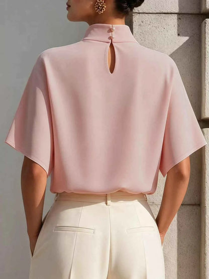 Blush pink women's mock neck short sleeve T-shirt by Trendsi, stylish and casual top for effortless everyday elegance.