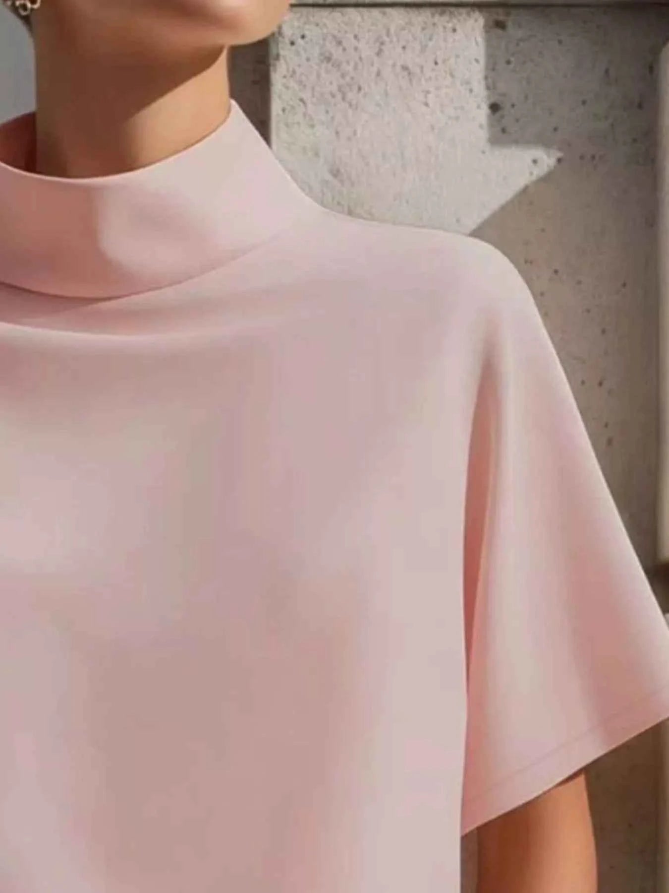 Blush pink women's mock neck short sleeve T-shirt by Trendsi, stylish and perfect for effortless everyday elegance.