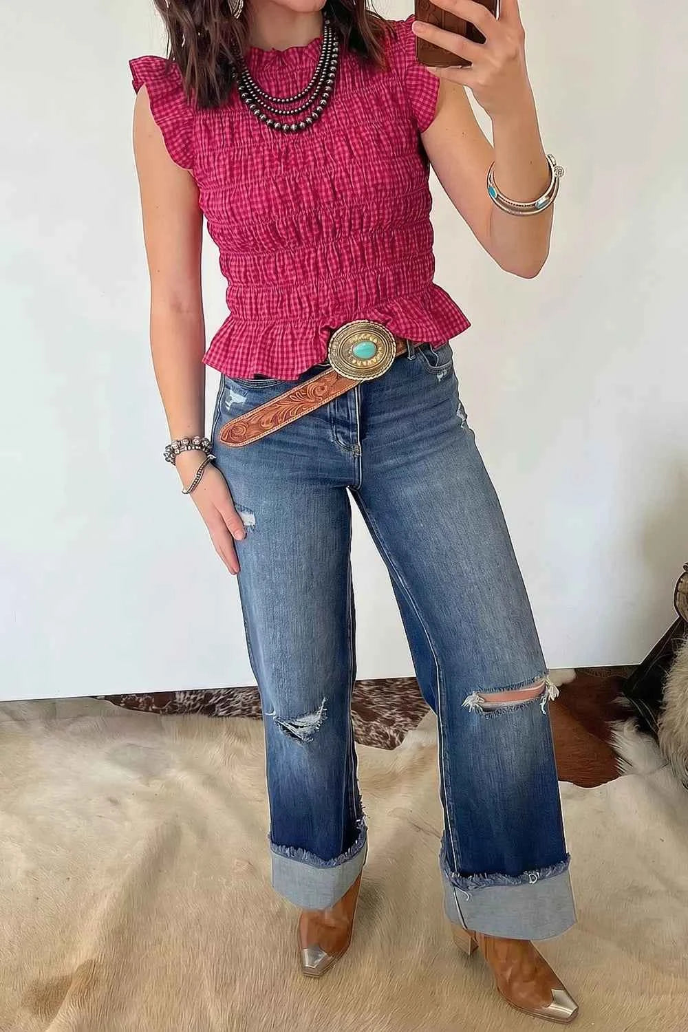 Cerise pink smocked gingham tank top for women with ruffle sleeve detail, featuring a chic, effortless style.