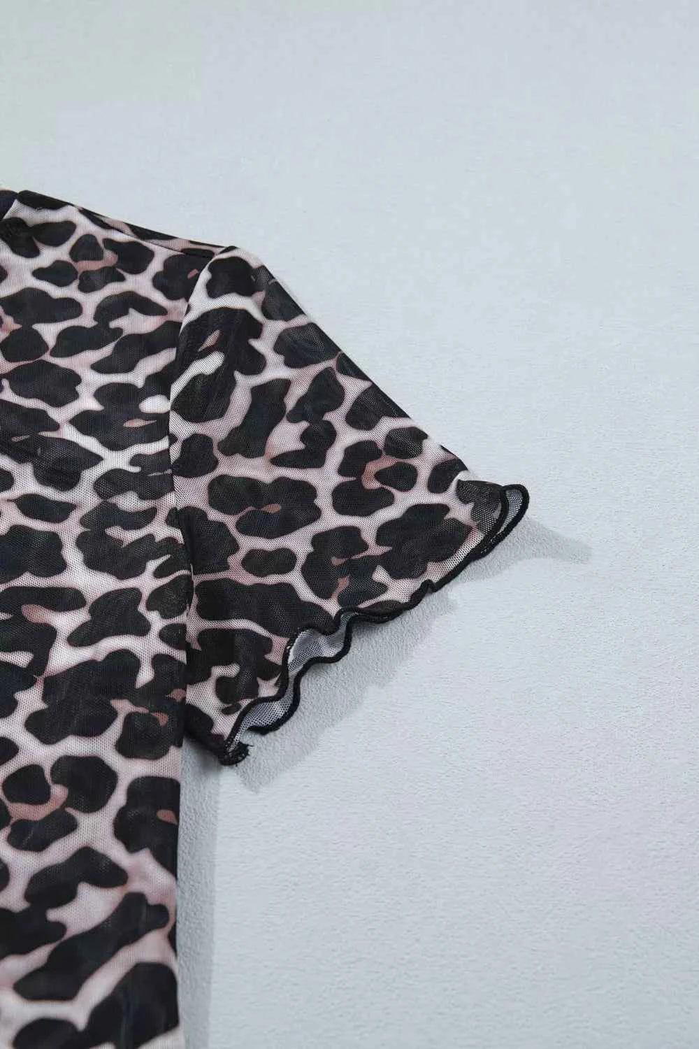 Leopard print sheer mesh top for women, stylish and versatile, featuring a chic design perfect for casual or dressy looks.