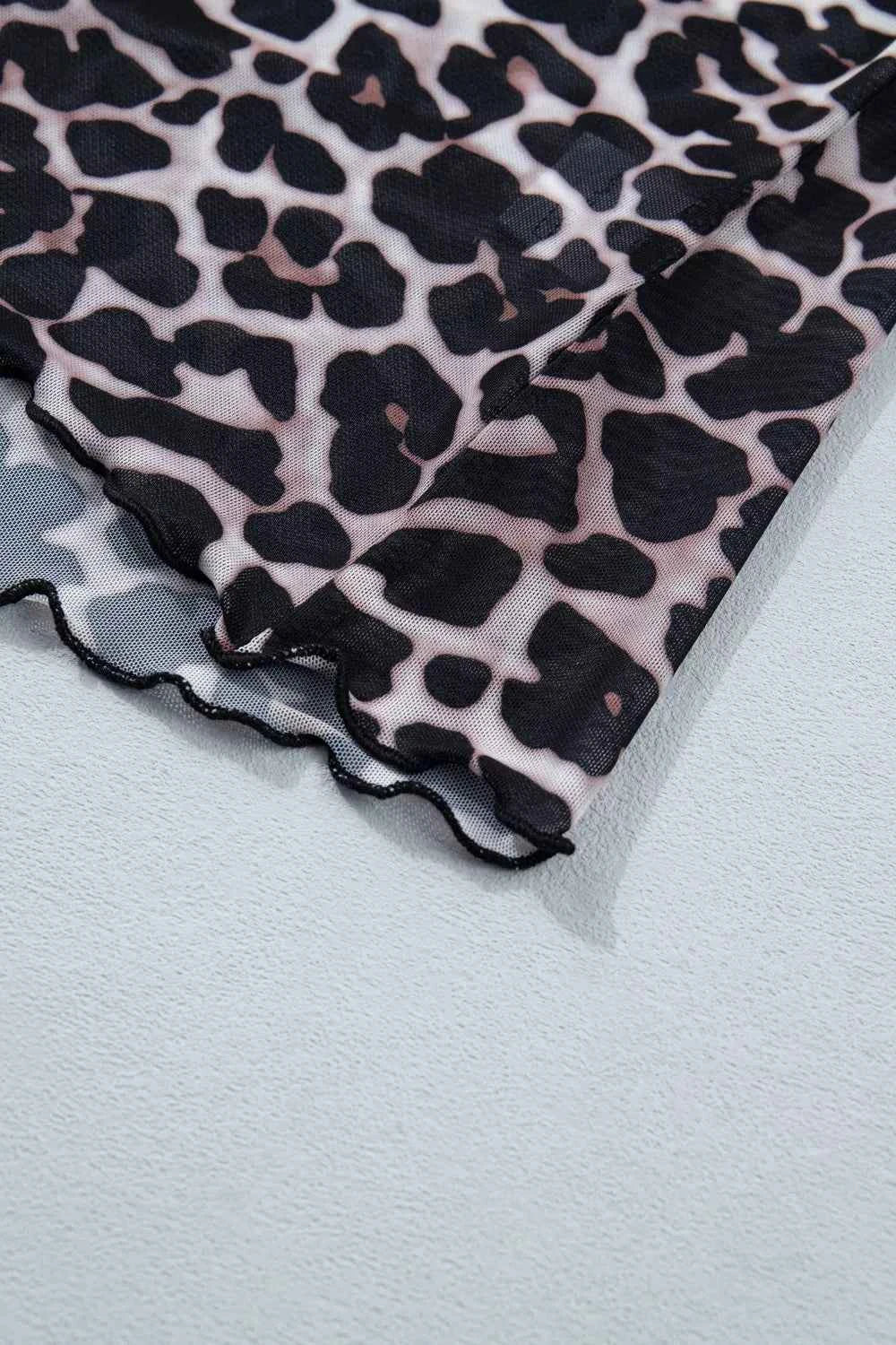 Leopard print sheer mesh top for women, stylish and versatile, featuring a chic design perfect for fashionable outfits.