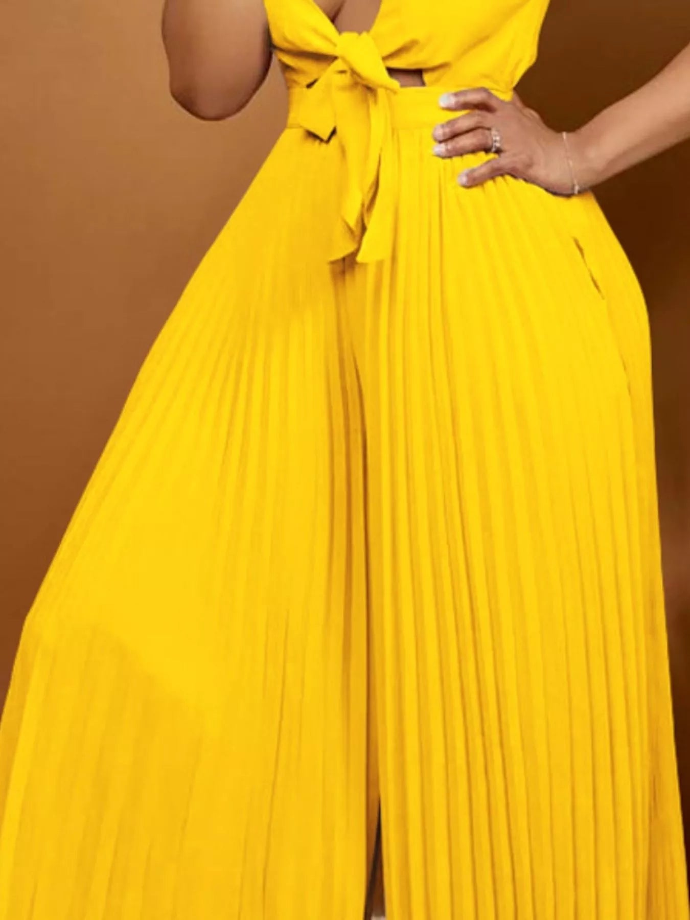Yellow plus size tie-front pleated wide-leg jumpsuit from Trendsi, featuring a full size fit and stylish design.