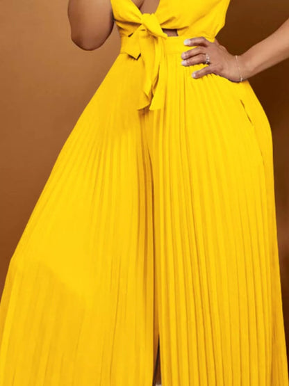 Yellow plus size tie-front pleated wide-leg jumpsuit from Trendsi, featuring a full size fit and stylish design.