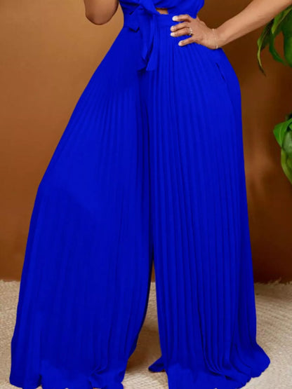 Yellow plus size tie-front pleated wide-leg jumpsuit by Trendsi, full-length front view showcasing the stylish design.