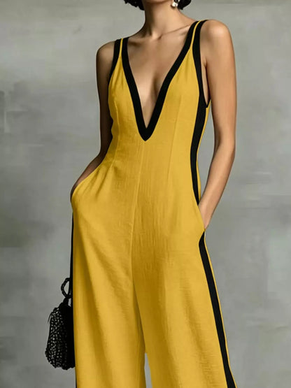 Deep V-neck wide-leg jumpsuit with contrast trim, unbranded, featuring a stylish and flowing design.