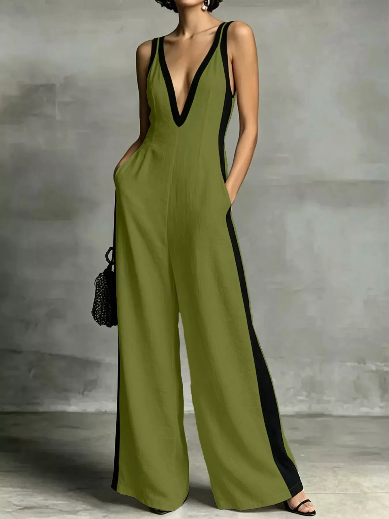Deep V-neck wide-leg jumpsuit with contrast trim, unbranded, featuring a stylish fit and fashionable design.