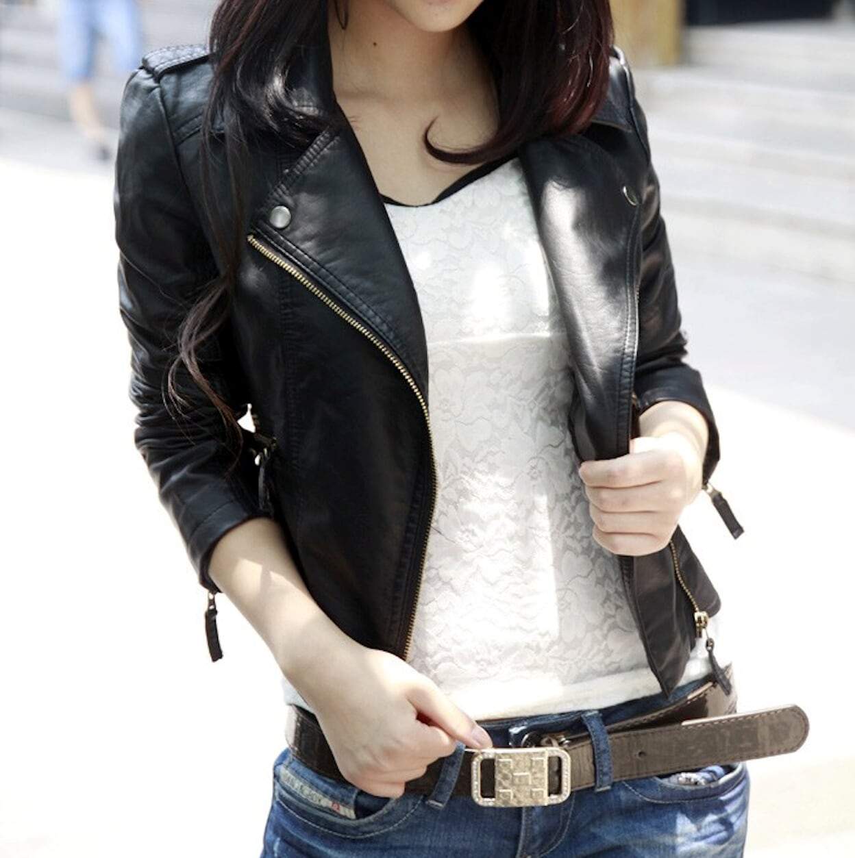 Yellow Pandora women's cropped vegan leather jacket displayed on a model, showing stylish collar and fitted design.